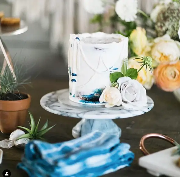 A styled dessert spread on one of the dark wood tables